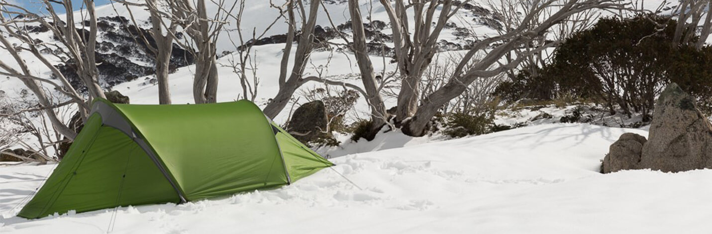 Green tent in the snow